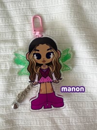 Image 3 of katseye 'winxeye' moveable wing keychains.