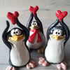 Valentine penguins. Heart up! Hand made pottery