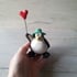 Balloon and green hat penguin.  Image 5