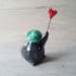 Balloon and green hat penguin.  Image 3