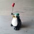 Balloon and green hat penguin.  Image 4