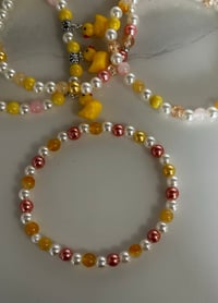 Image 8 of Rubber Ducky Tumbler Bracelet Stack – Yellow Duck Beaded Cup Charm Set