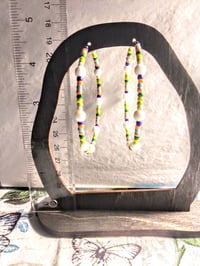 Image 5 of Delphinium White, Leaf Green, Yellow, and Orange Multicolor Beaded Large Hoop Earrings