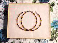 Image 7 of Plumeria Orange, Ocean Blue, Black, and Burgundy Multicolor Beaded Large Hoop Earrings