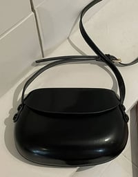 Image 2 of Leather handbag with a rounded shape Black 