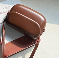 Image 2 of Leather handbag with a rounded shape Brown