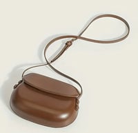 Image 1 of Leather handbag with a rounded shape Brown