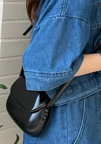 Image 1 of Leather handbag with a rounded shape Black 