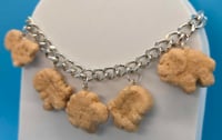Image 1 of Dino charm bracelet