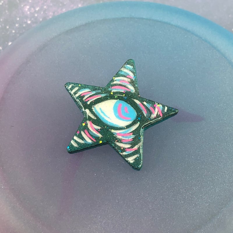 Image of Iridescent Green, Blue, Pink, and White Eyeball Star Pin