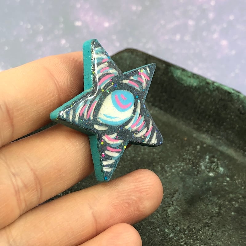 Image of Iridescent Green, Blue, Pink, and White Eyeball Star Pin