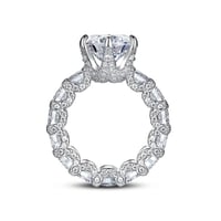 The Deluxe Ring stands as a true jewelry masterpiece, its central gem radiating exceptional brillian