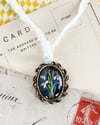 Snowdrops in vintage pendant