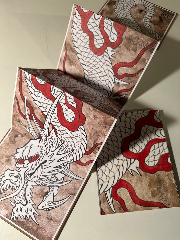 Image of White dragon fold out book.