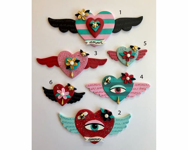 Your choice of 18 Winged Hearts with Eyes, Bees and Flowers Clay Wall Hangings