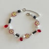 red flower and black lining nana wire bracelet