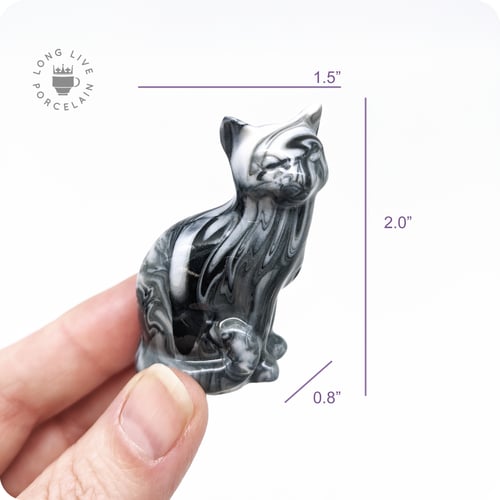 Image of Black and White Porcelain Cat Figurine with Marble Pattern