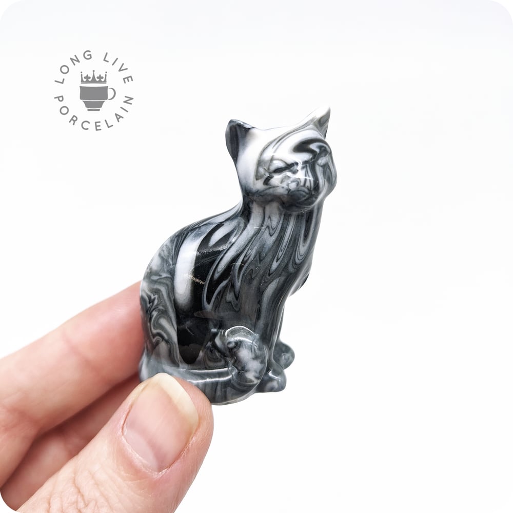 Image of Black and White Porcelain Cat Figurine with Marble Pattern