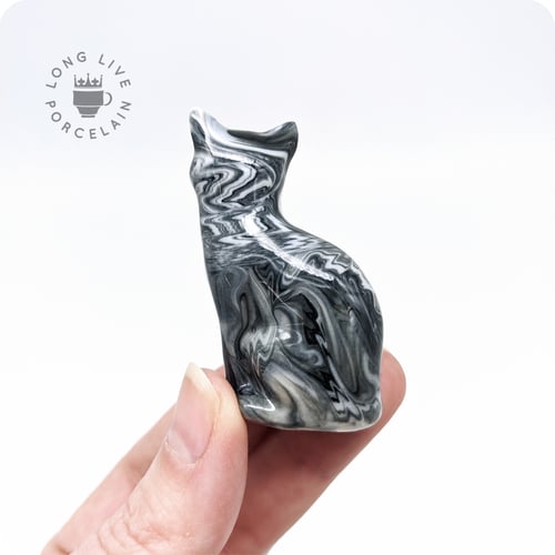 Image of Black and White Porcelain Cat Figurine with Marble Pattern