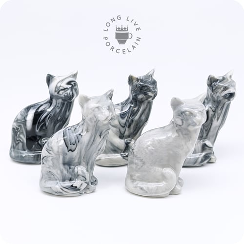 Image of Black and White Porcelain Cat Figurine with Marble Pattern