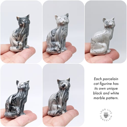 Image of Black and White Porcelain Cat Figurine with Marble Pattern