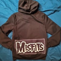 Image 1 of The Misfits zip front patch hoodie sweatshirt, size S. Black full zip hoodie sweatshirt size S