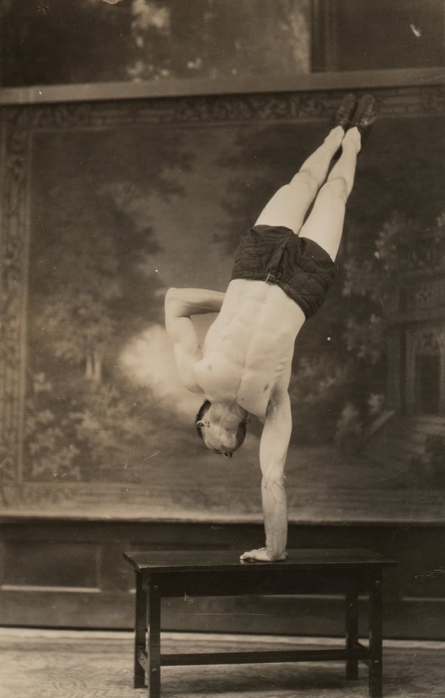 Image of Unknown: Robert Jones balancing on one hand, ca. 1927
