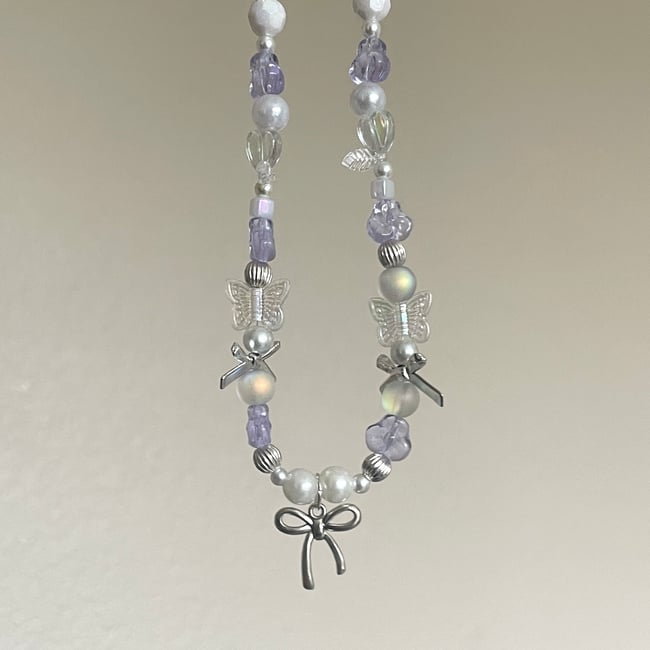 bow and alexandrite glass coquette necklace