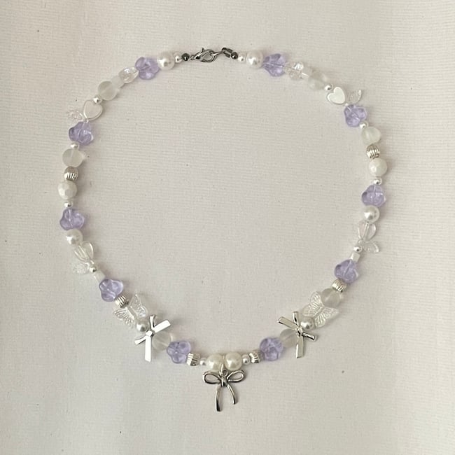 bow and alexandrite glass coquette necklace