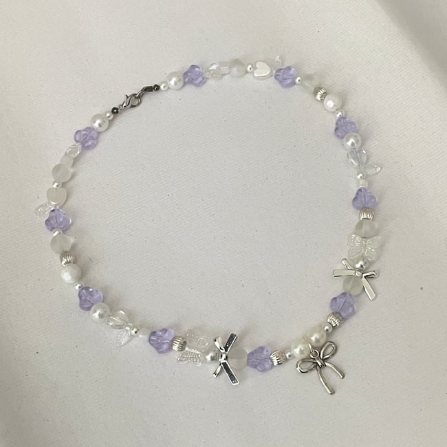 bow and alexandrite glass coquette necklace