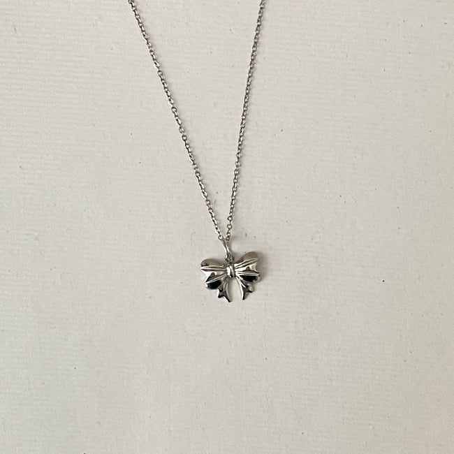 silver bow stainless steel necklace