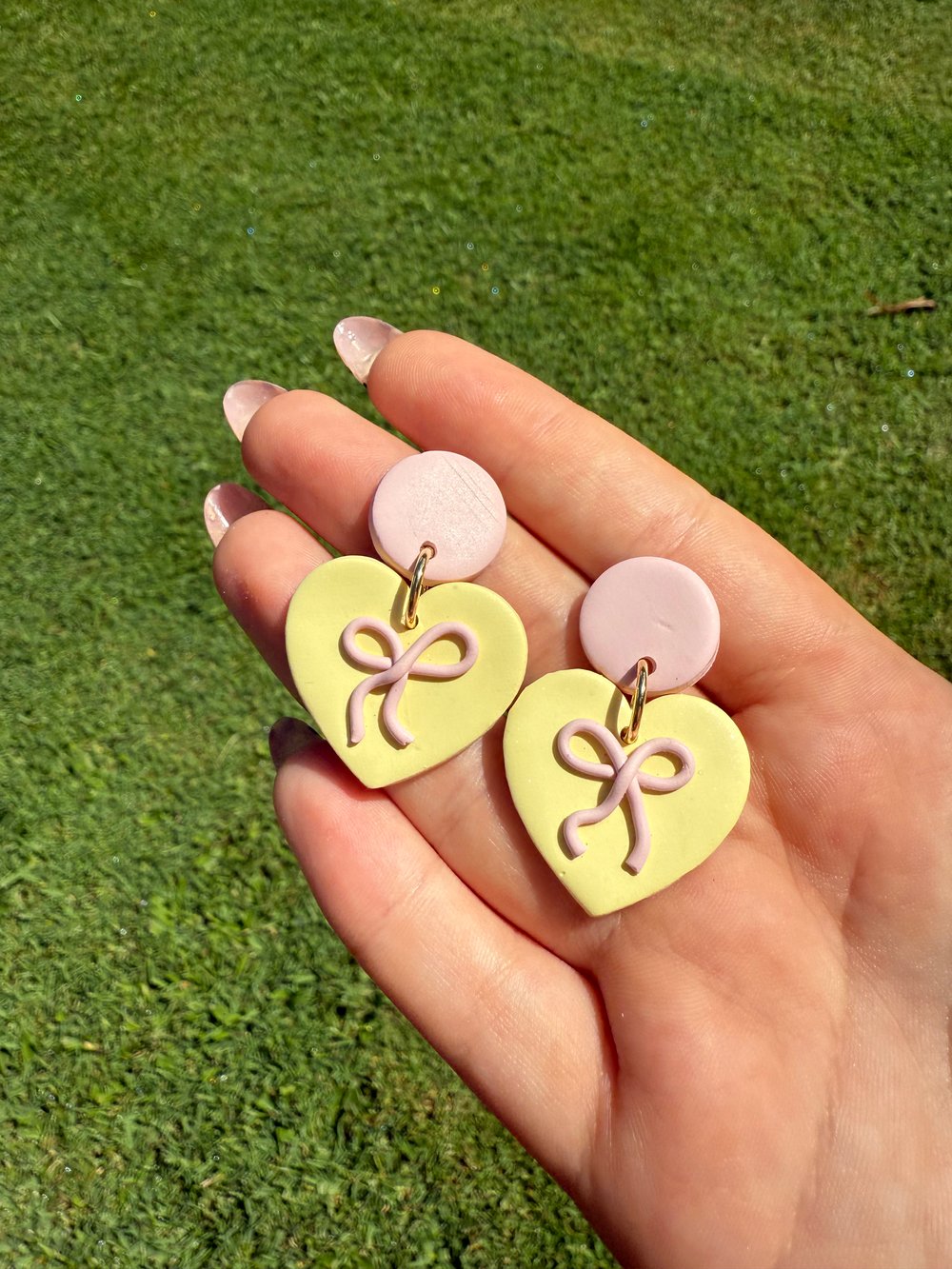 Image of baby yellow & pink Bow Heart dangles
