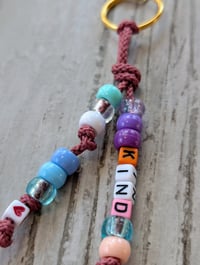 Image 2 of Colorful beaded keychain with the word KIND 