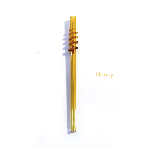 Image of spiral straw in honey