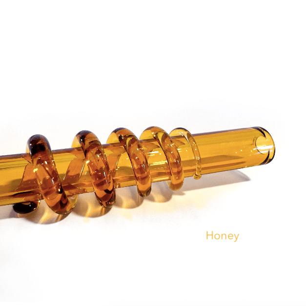 Image of spiral straw in honey