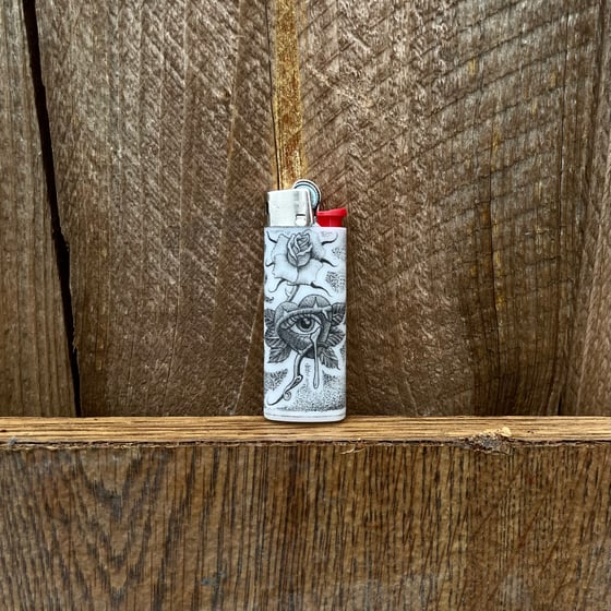 Image of Sad eye lighter 