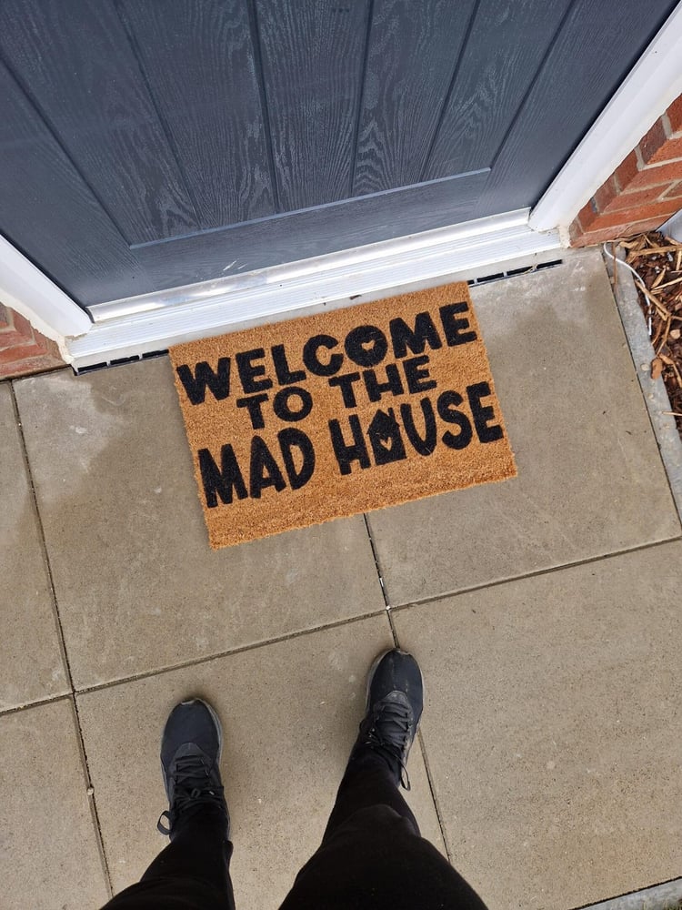 Image of Welcome to the mad house. Hand painted door mat.