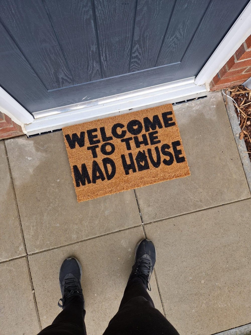 Image of Welcome to the mad house. Hand painted door mat.