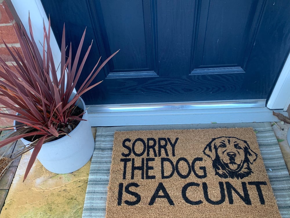 Image of Dog face design hand painted coir door mat. The wording can be changed to anything you would like...