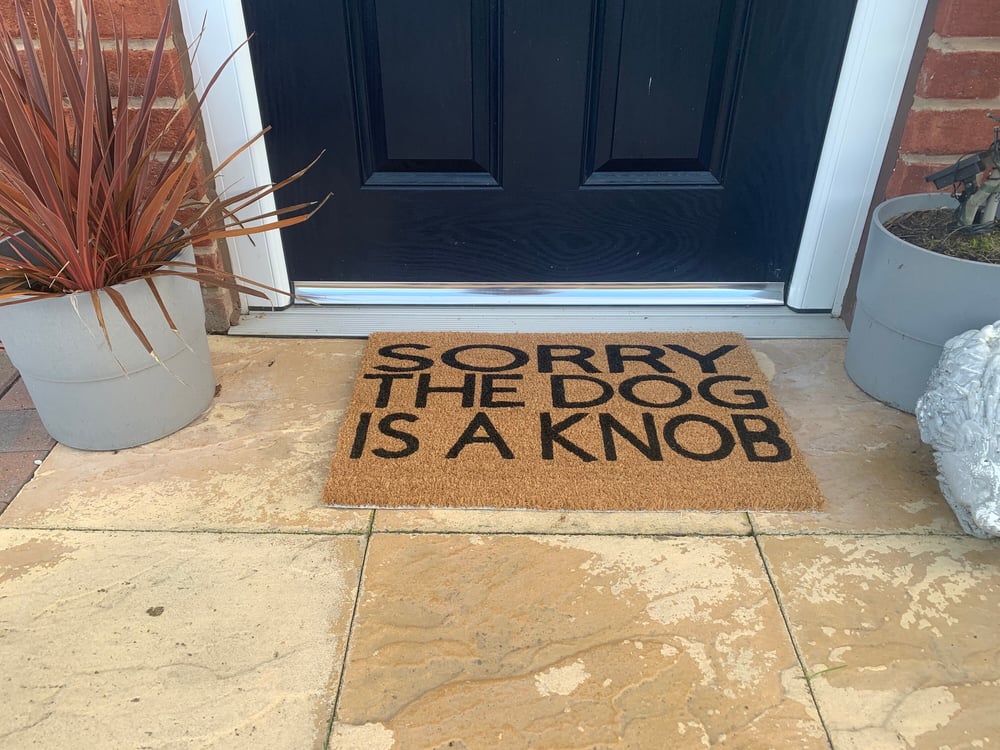Image of Dog is a Knob personalised door mat. No silhouette just the writing. Hand painted. Makes the perf...