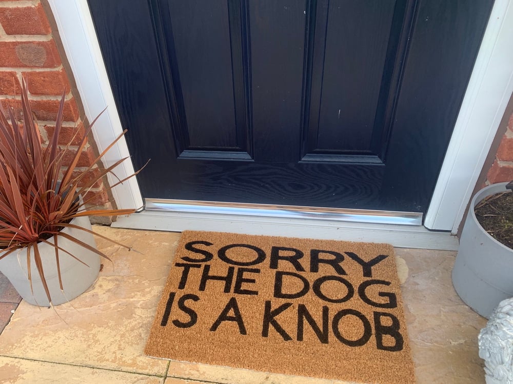 Image of Dog is a Knob personalised door mat. No silhouette just the writing. Hand painted. Makes the perf...