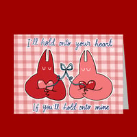 Image of holding heart card