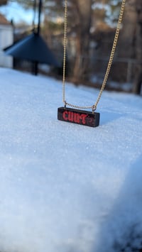 Image 1 of Red on black on gold necklace