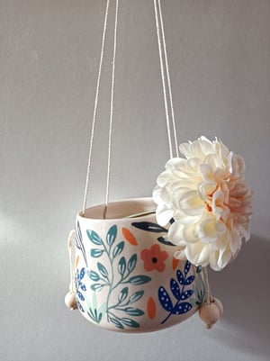 Image of Pot suspendu fleur feuillage bleu 