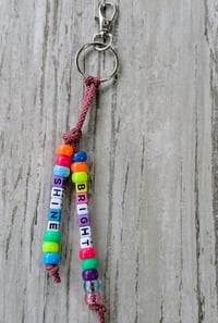 Image 1 of Vibrant beaded bag charm/keychain with SHINE BRIGHT text 