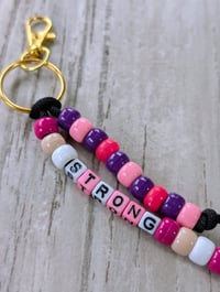 Image 2 of Pink and purple beaded STRONG bag charm keychain 