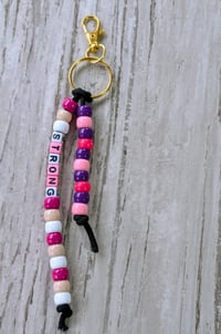 Image 1 of Pink and purple beaded STRONG bag charm keychain 