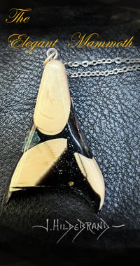 043 Galactic Flight. Fine jewelry made from ancient mammoth ivory. Pendent by Jock Hildebrand.