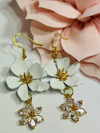 Image 3 of White & Rhinestone Flower Earrings
