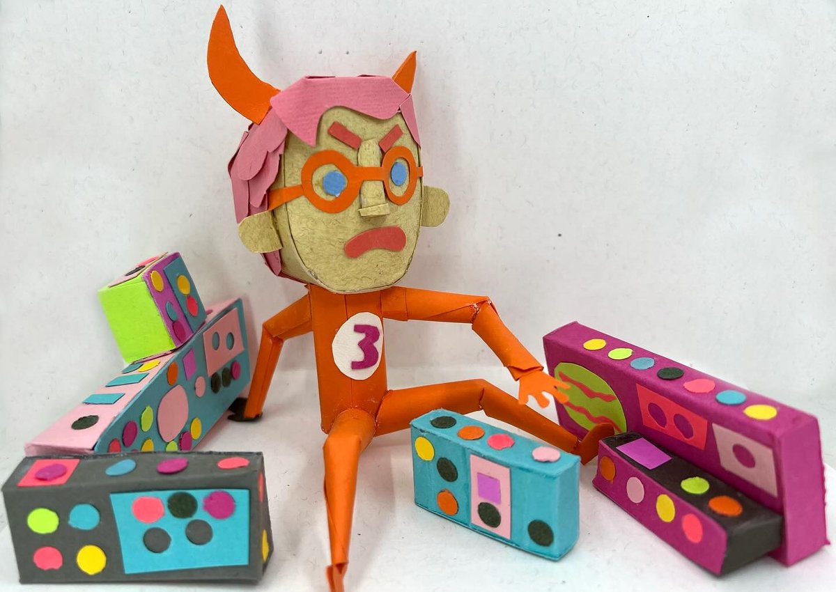 Image of Angry synth man plays a concert. paper sculpture